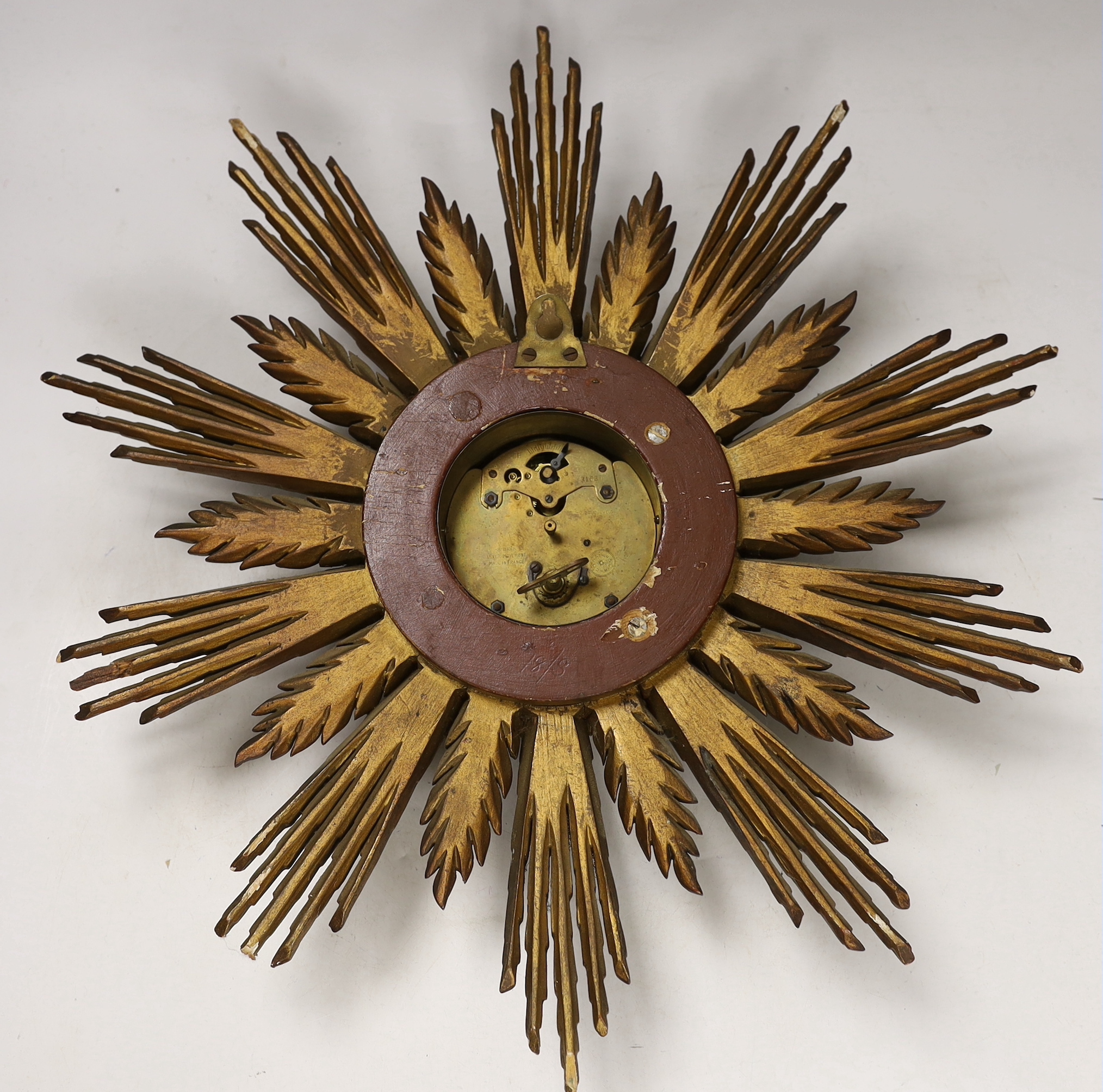 A giltwood starburst wall timepiece, 47cm high